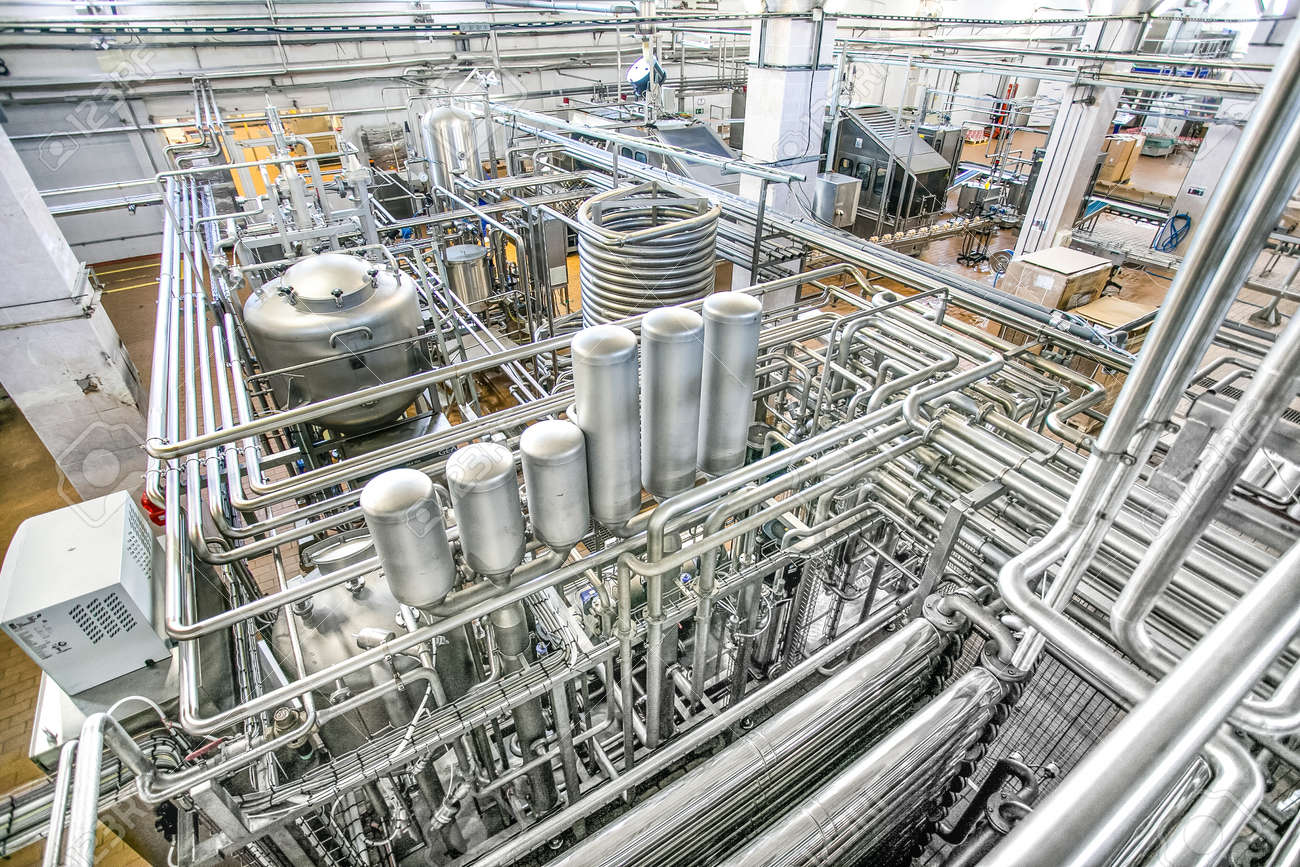 Large tanks and many shiny tubes plan view in the milk factory - 53401421 Large tanks and many shiny tubes plan view in the milk factory - 53401421