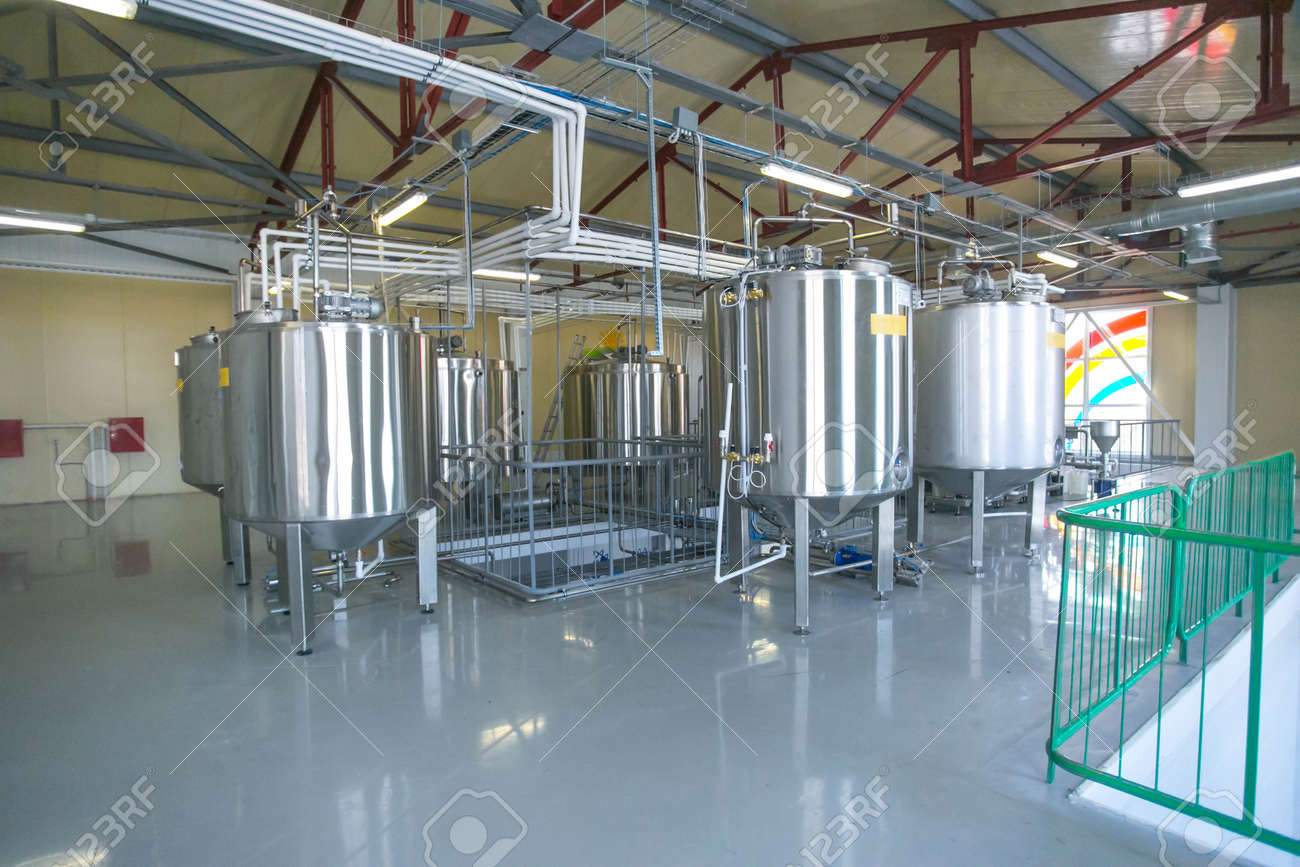 Tank with liquid at factory of dairy product keeping temperature at warehouse hall - 53401149 Tank with liquid at factory of dairy product keeping temperature at warehouse hall - 53401149