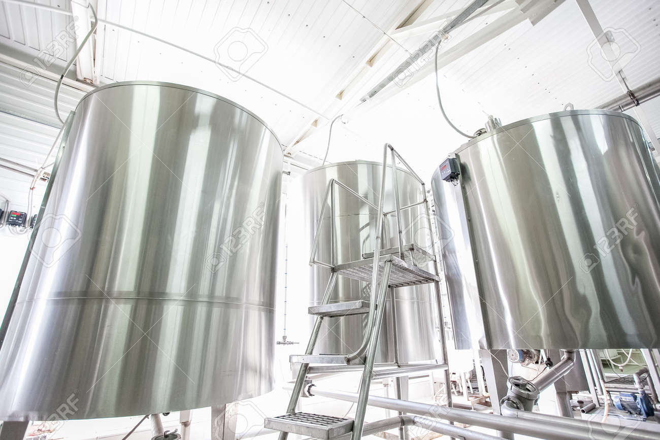 Steel new big vats on raw milk modern factory at sunny day - 54434964 Steel new big vats on raw milk modern factory at sunny day - 54434964