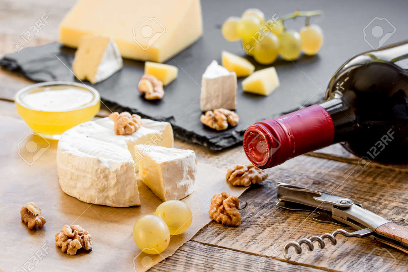 Download Bottle Of Red Wine Appetizers And Corkscrew On Wooden Background Stock Photo Picture And Royalty Free Image Image 69683194 Yellowimages Mockups