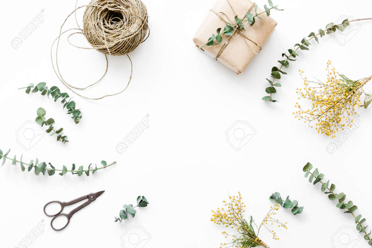 Gift box with flowers for holiday on white table background top view space for text - 75151577 Gift box with flowers for holiday on white table background top view space for text - 75151577