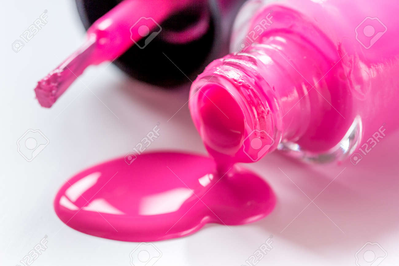 bottles with spilled nail polish over white background mockup stock