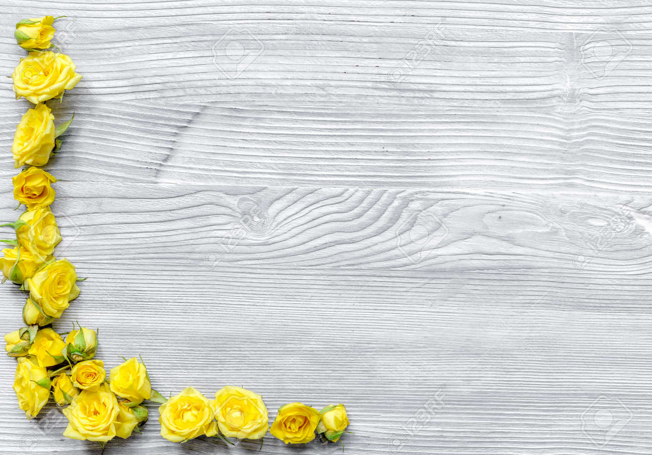 Download Spring Concept With Yellow Flowers On Light Wooden Table Background Stock Photo Picture And Royalty Free Image Image 75578027 PSD Mockup Templates