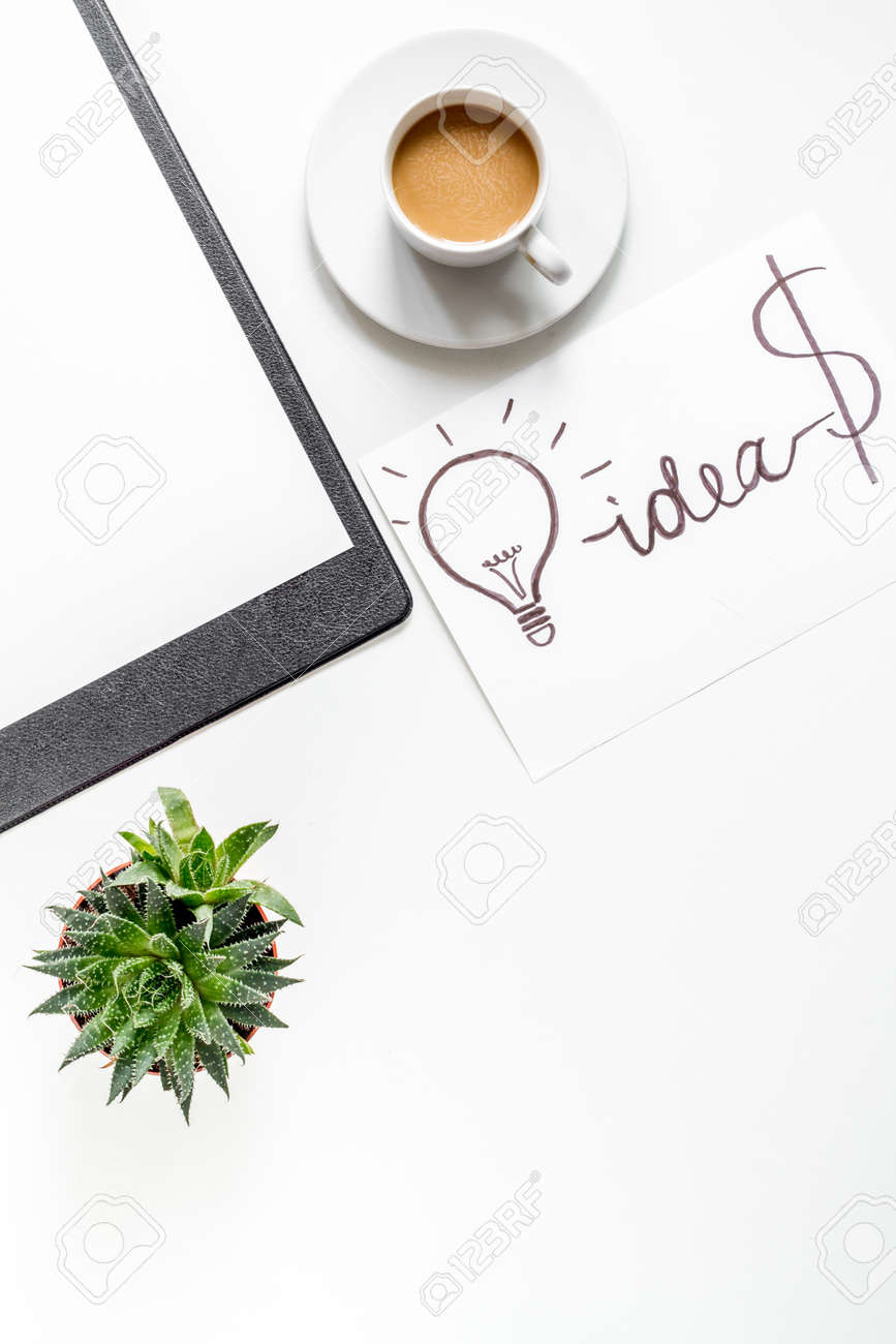 business plan development with board and cup of coffee on white