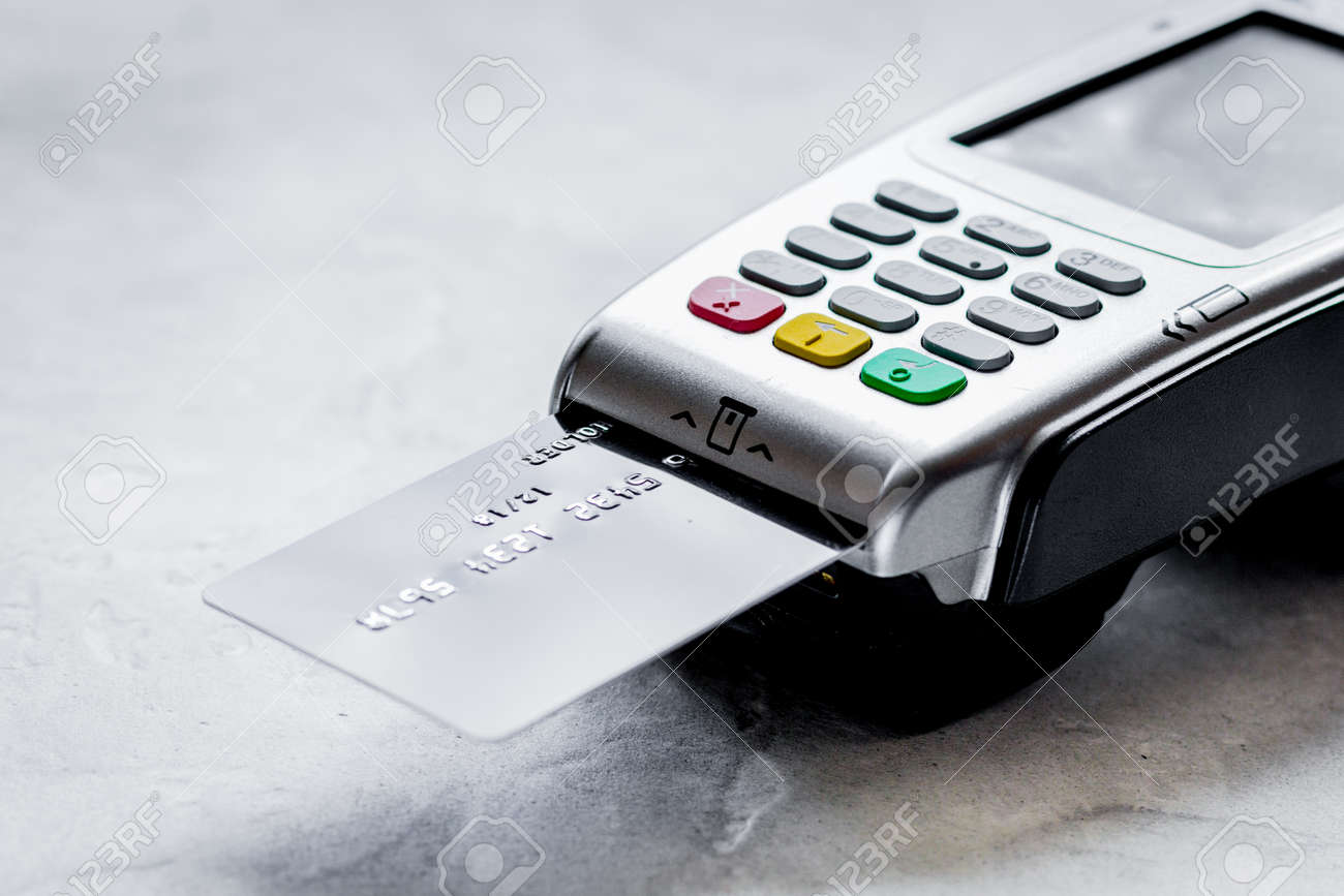 purchasing concept with card payment and terminal on table backg - 103054234 purchasing concept with card payment and terminal on table backg - 103054234