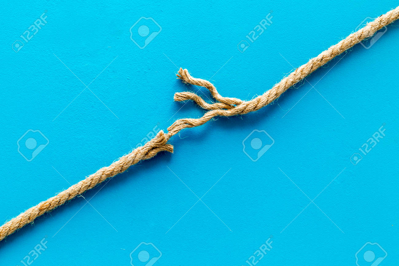 stress concept with breaking rope on blue background top view mock-up - 130138843 stress concept with breaking rope on blue background top view mock-up - 130138843