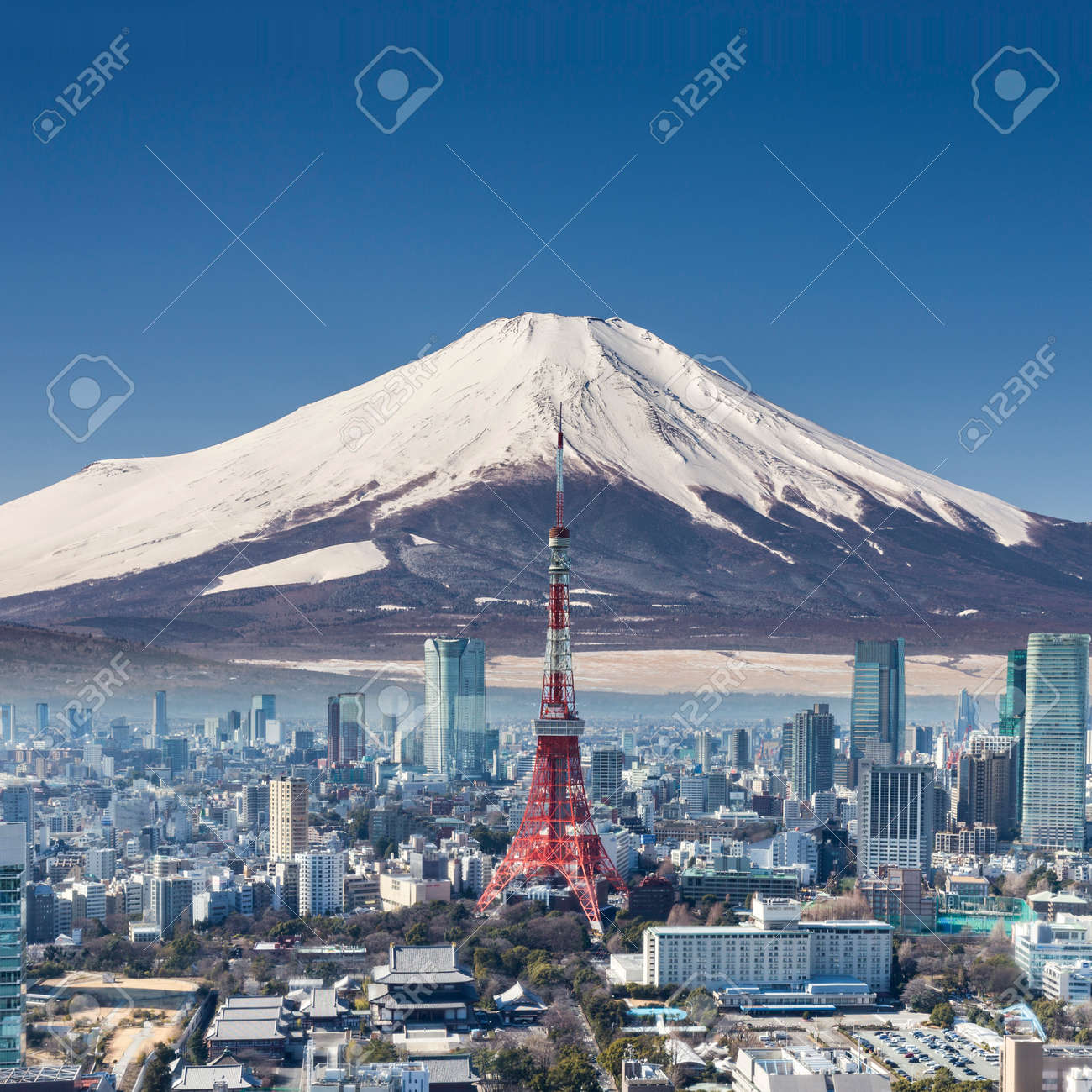 tokyo tower with mountain fuji background surreal shot stock photo