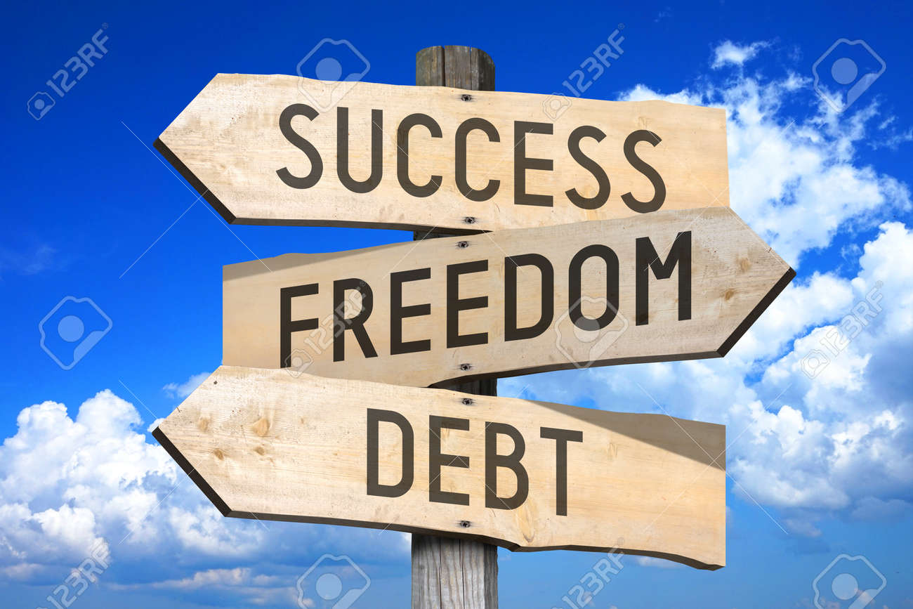 wooden signpost success freedom debt freedom debt