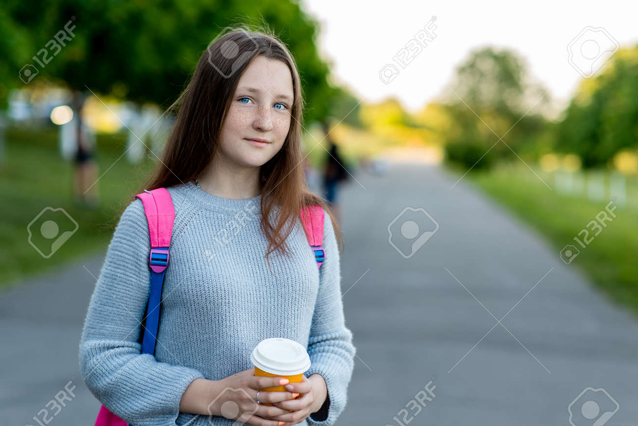 Beautiful Brunette Teen Girl Summer In Nature In His Hands Holds A Glass With Beautiful Brunette Teen Girl Summer In Nature In His Hands Holds A Glass With