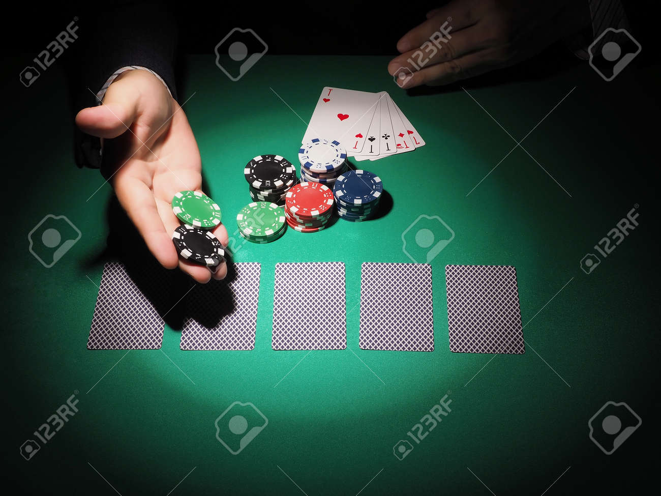 Picture Of A Green Table And Betting With Chips Man Hand Over Casino Chips On Roulette Table Close Up Stock Photo Picture And Royalty Free Image Image 53162659