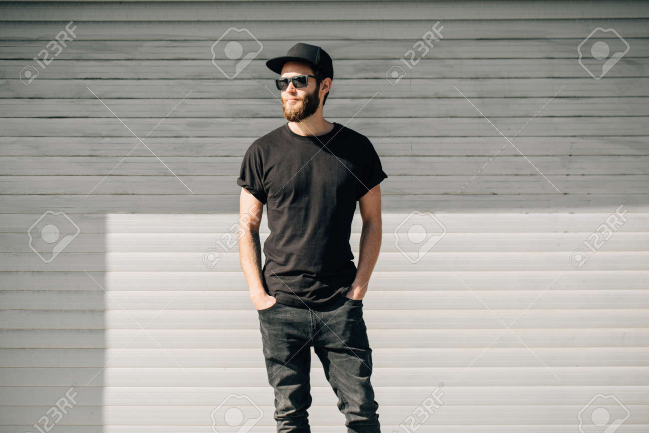 Hipster handsome male model with beard wearing black blank t-shirt with space for your logo or design in casual urban style - 87436201 Hipster handsome male model with beard wearing black blank t-shirt with space for your logo or design in casual urban style - 87436201