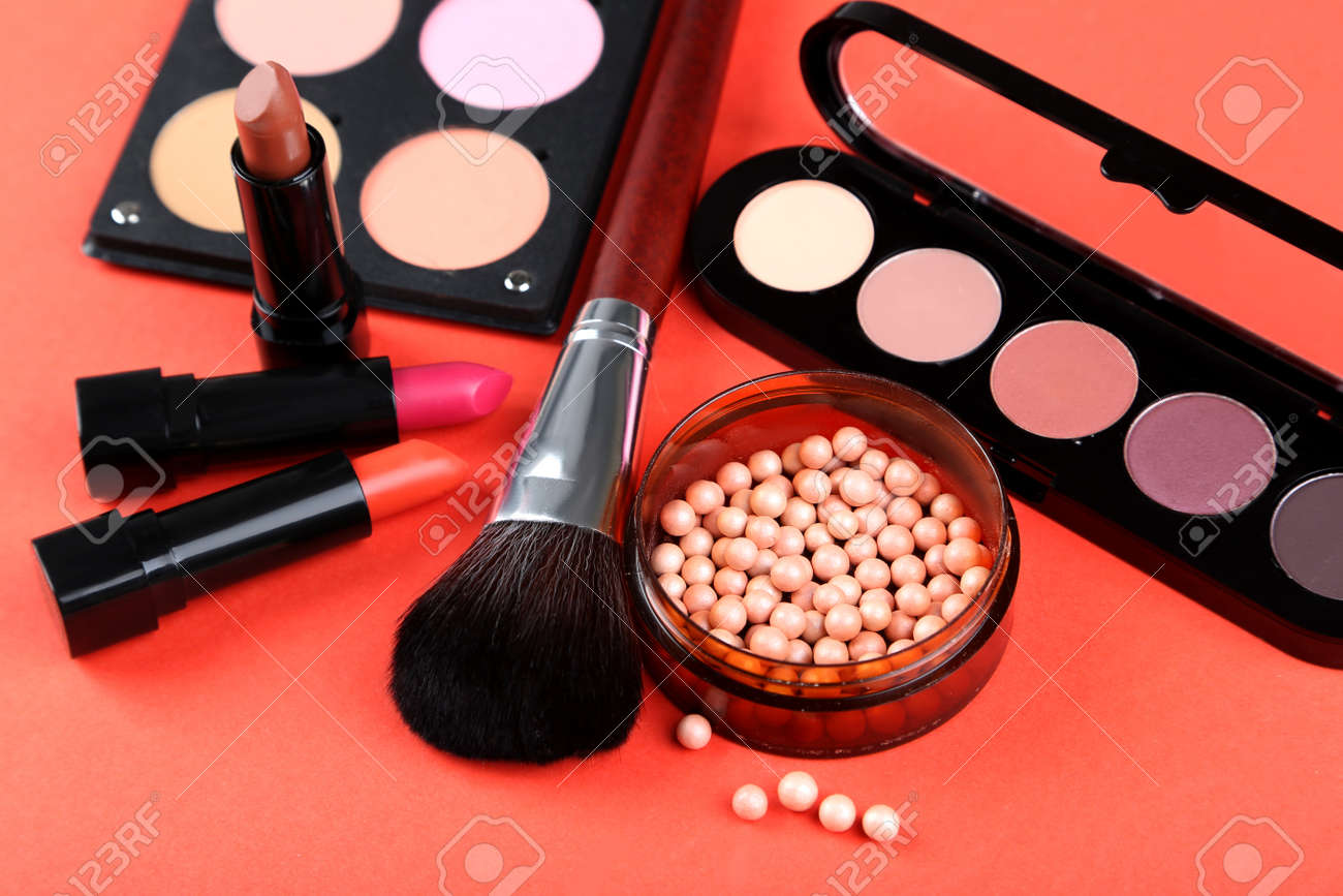 Makeup brush and cosmetics on a red background - 50516060 Makeup brush and cosmetics on a red background - 50516060