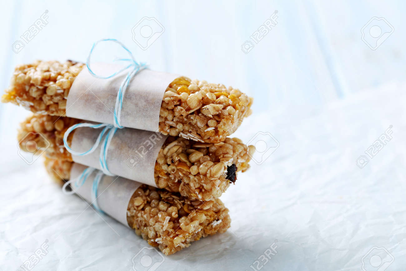 Granola bar on a blue wooden table - 56545610 Granola bar on a blue wooden table - 56545610