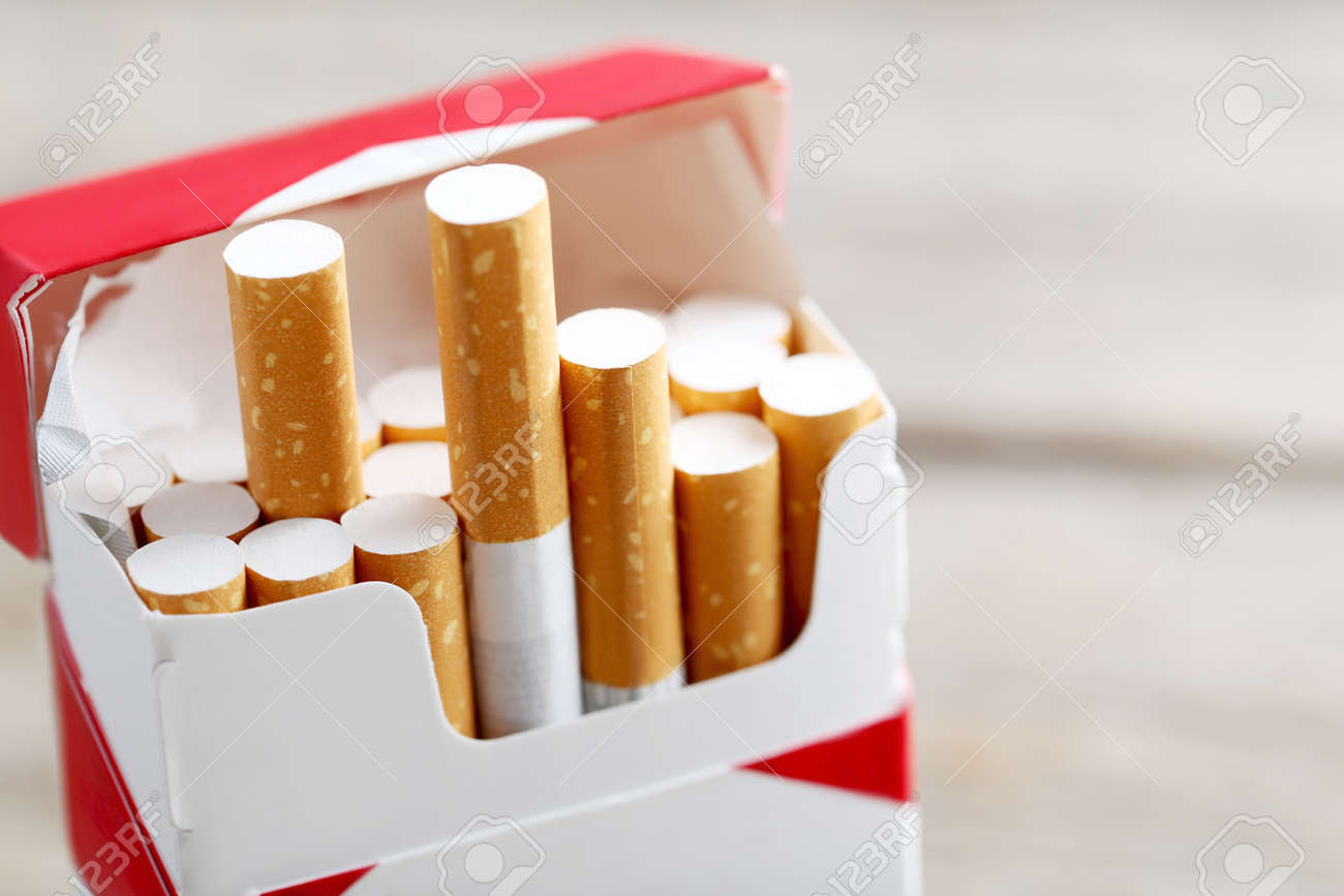 Open pack of cigarettes - 64613580 Open pack of cigarettes - 64613580
