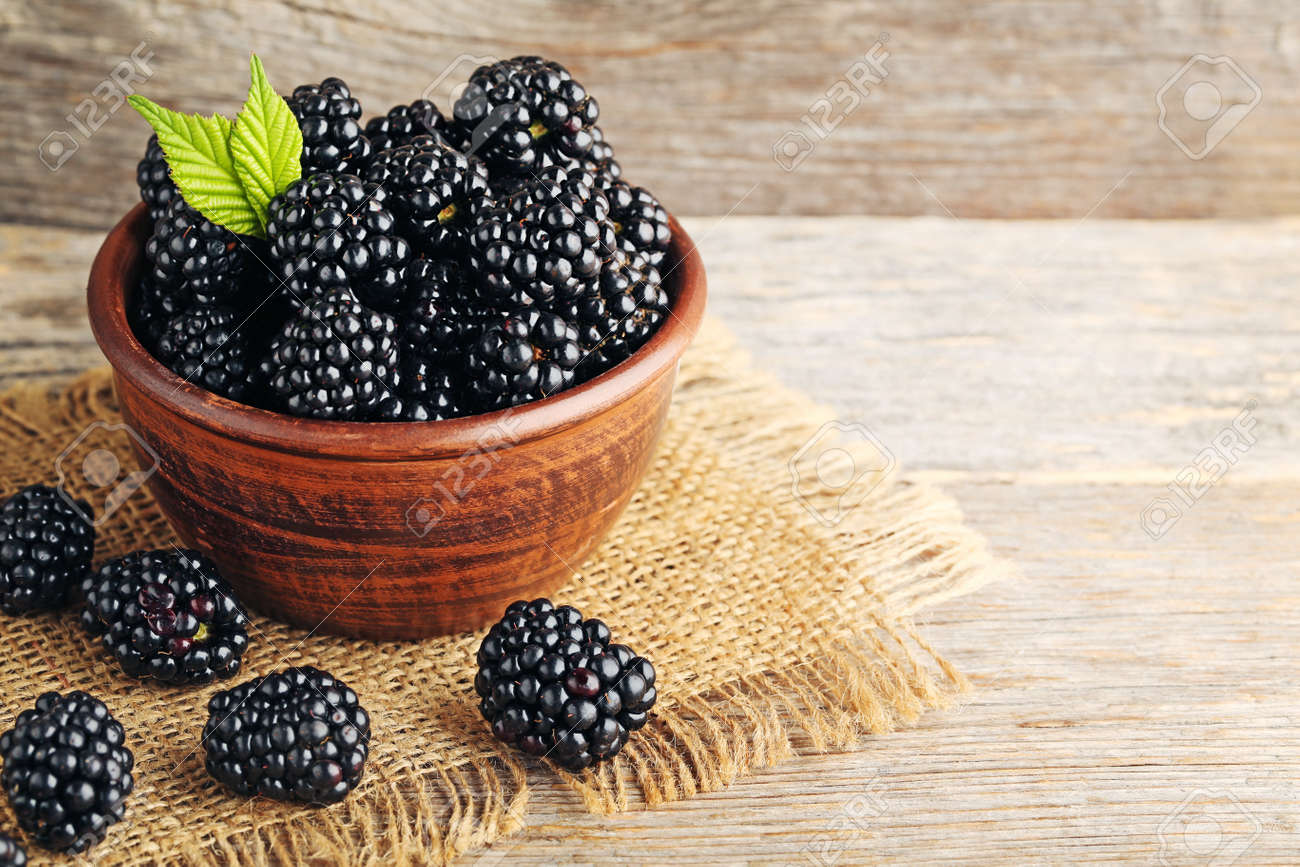 Ripe blackberries in bowl on wooden table - 88936157 Ripe blackberries in bowl on wooden table - 88936157
