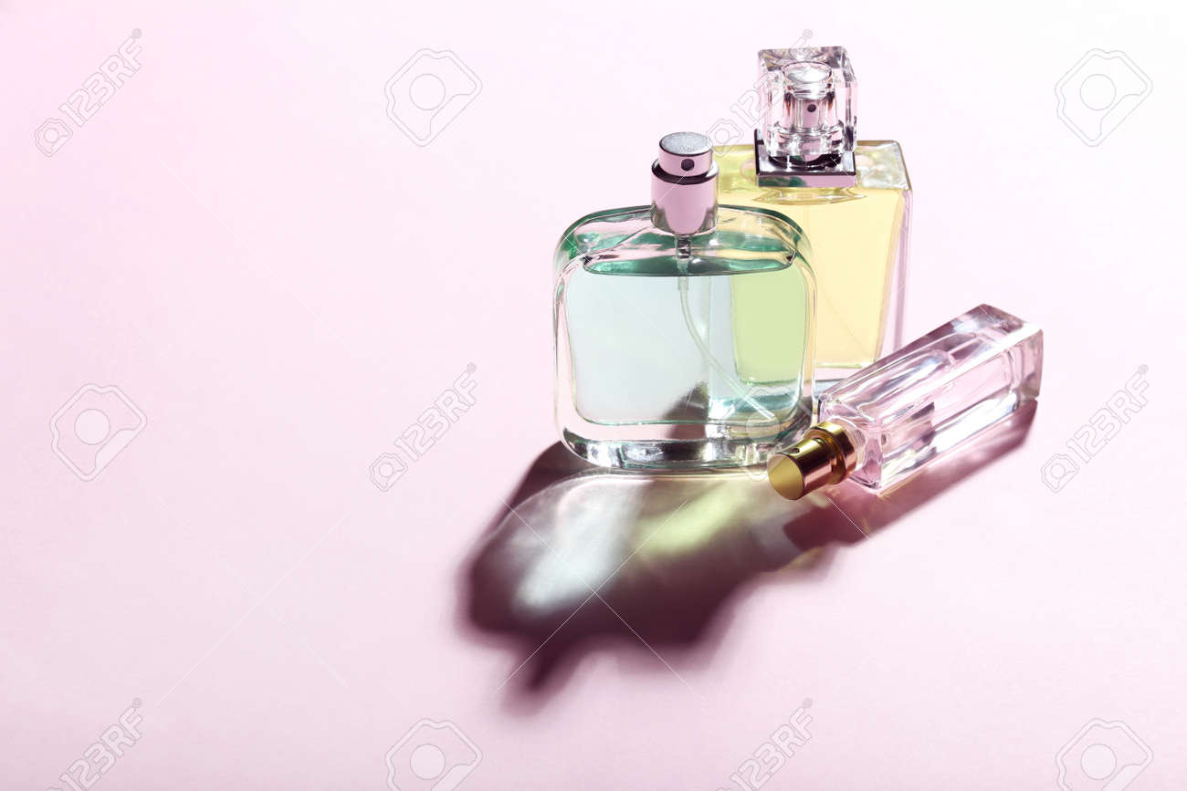Perfume bottles on pink background - 97393038 Perfume bottles on pink background - 97393038