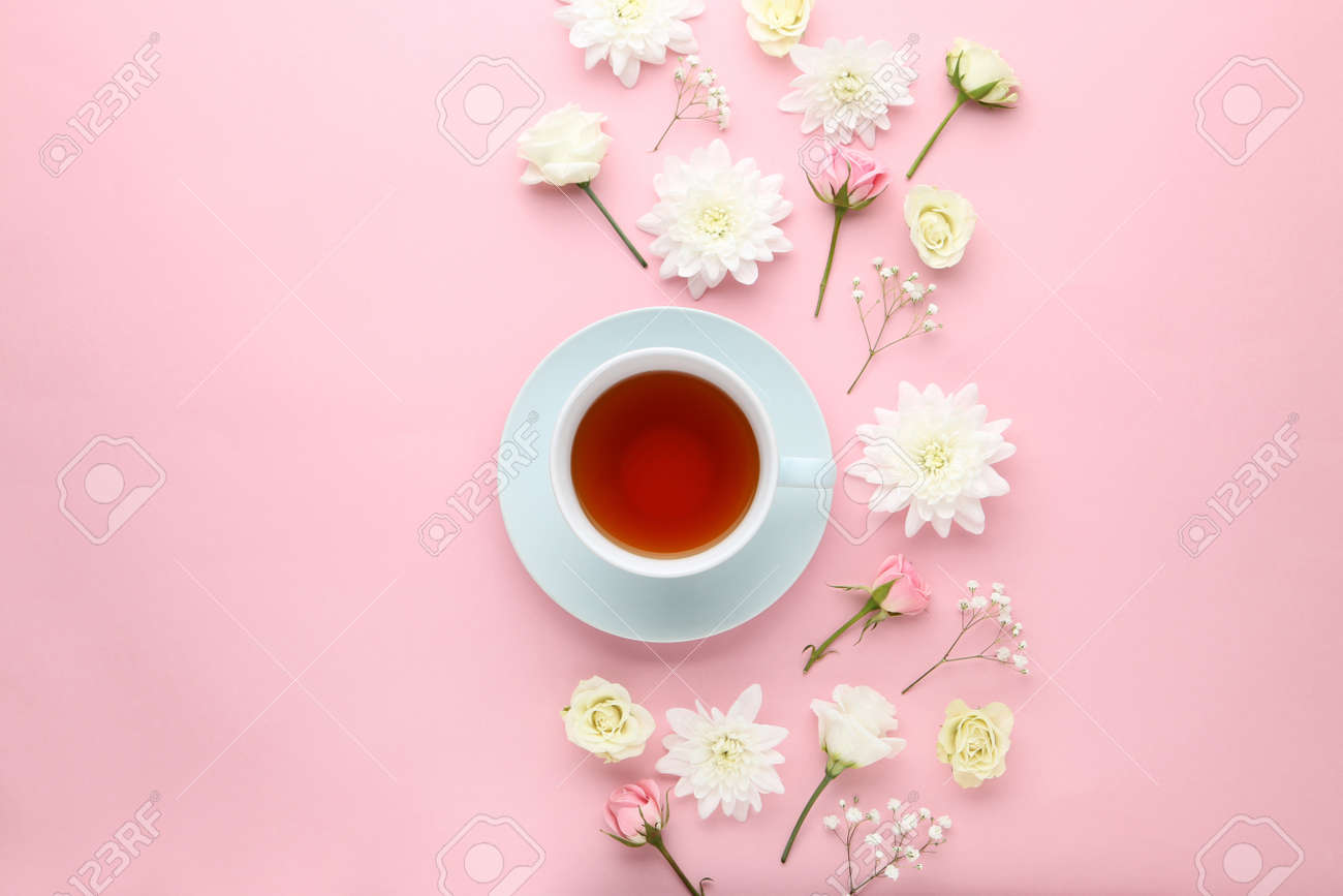 Flowers with cup of tea on pink background - 105954993 Flowers with cup of tea on pink background - 105954993