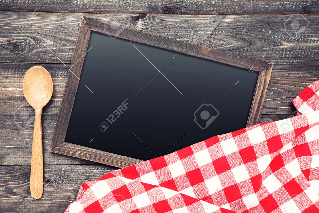 Blank chalkboard with red napkin and spoon on wooden background - 116434466 Blank chalkboard with red napkin and spoon on wooden background - 116434466