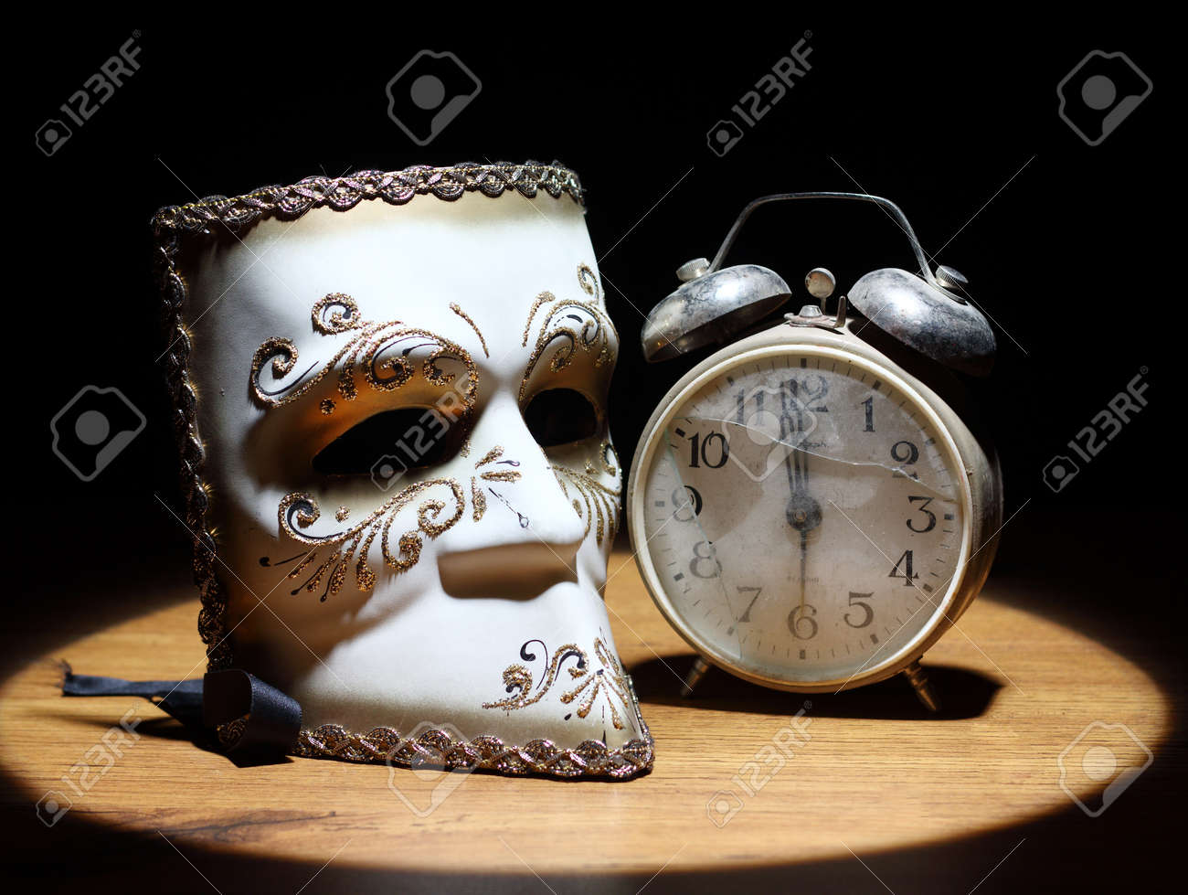 Carnival Mask And Old Broken Alarm Clock Stock Photo, Picture and Royalty  Free Image. Image 14618287., image size:1300x979