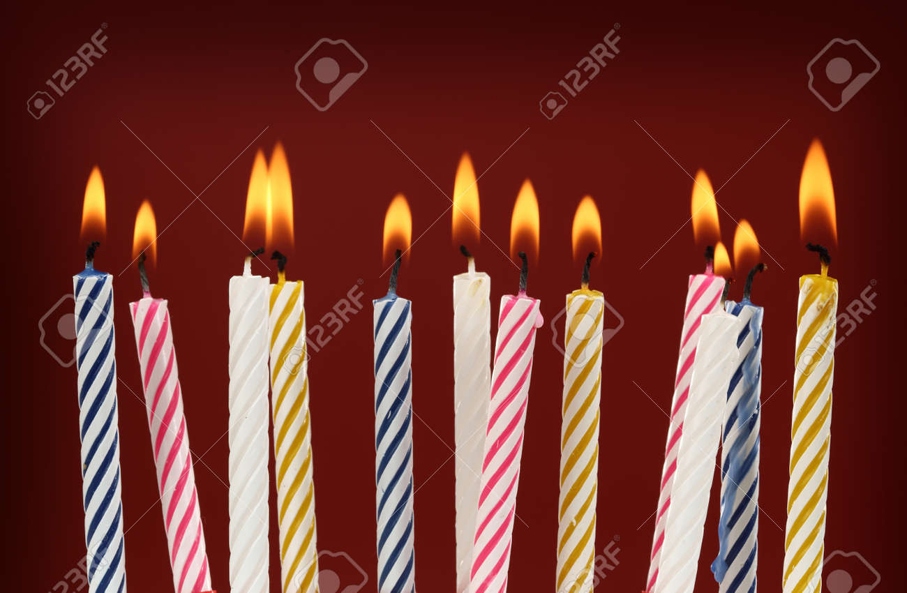 some lit birthday candles close up stock photo picture and royalty