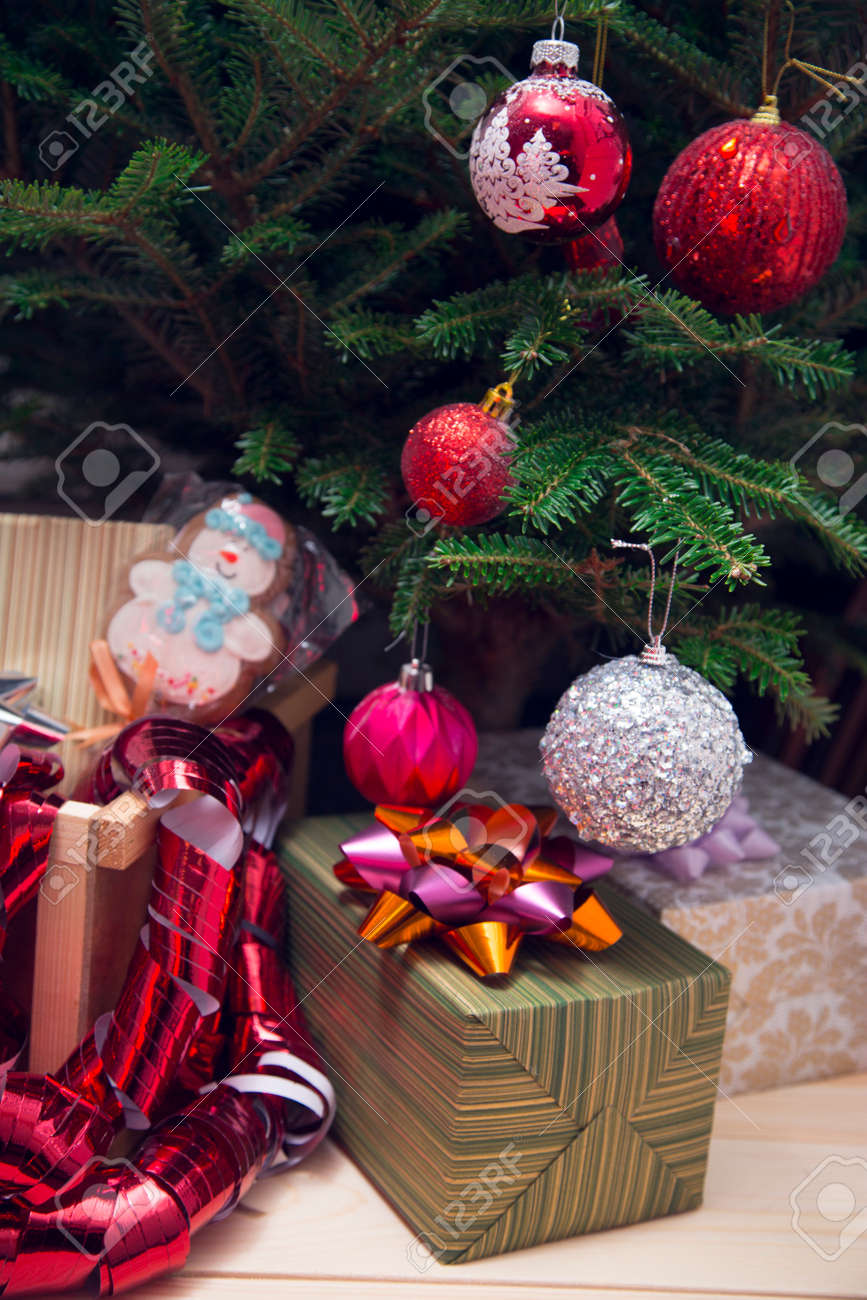 Gifts Under A Decorated Christmas Tree Green Striped Gift Box With Purple
