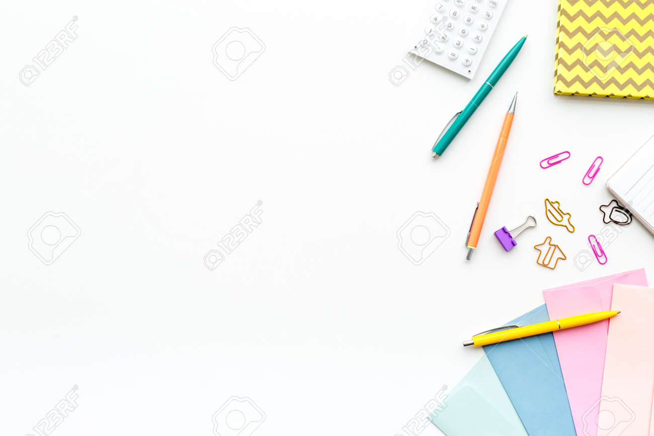 Scattered stationery on student's desk. White background top view. - 94963689 Scattered stationery on student's desk. White background top view. - 94963689