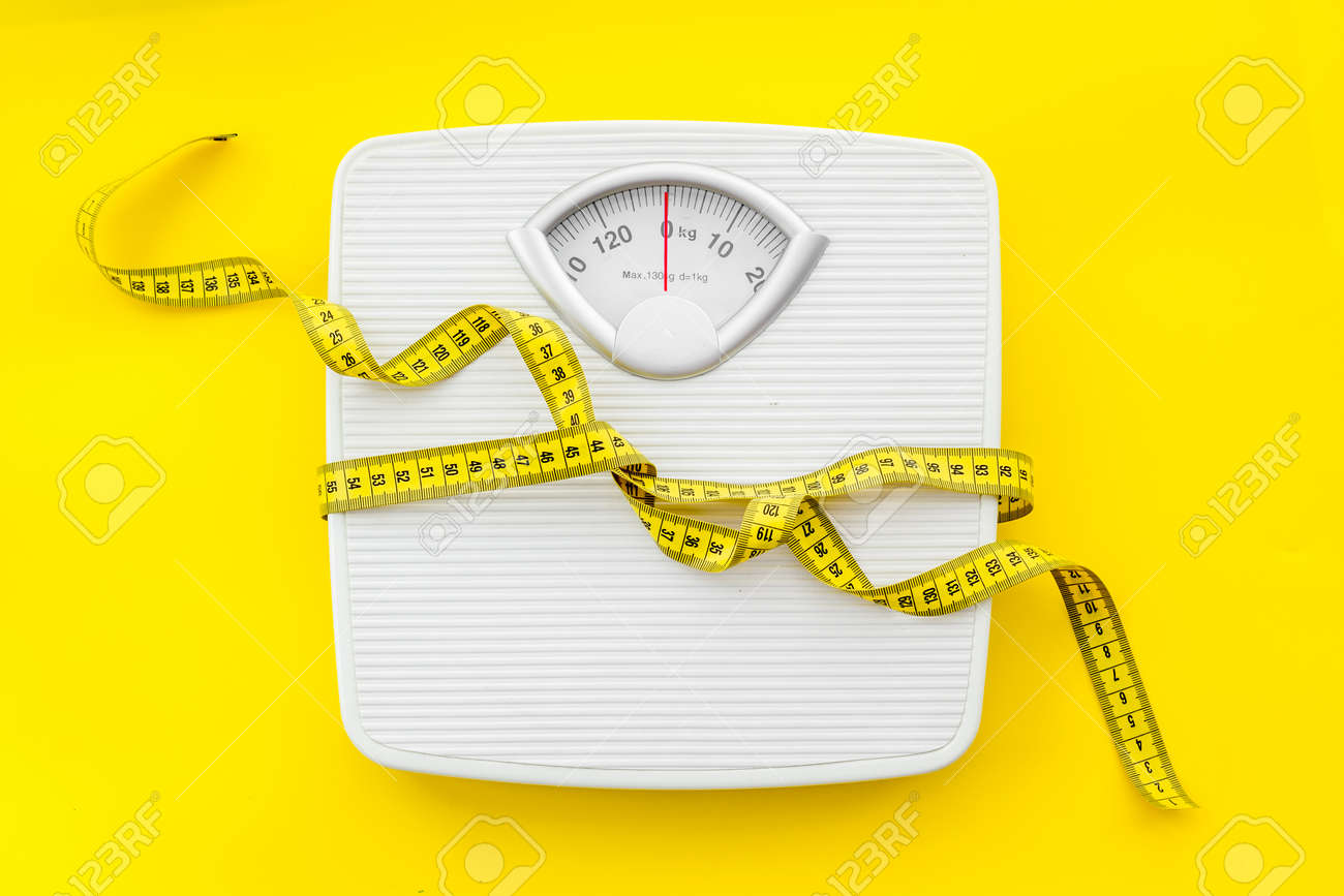 Weighing scales with measuring tape weight loss Vector Image