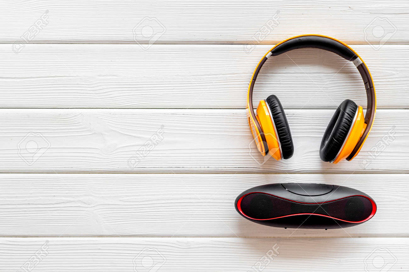 Download Wireless Speaker And Headphones As Music Gadgets On White Wooden Stock Photo Picture And Royalty Free Image Image 128631055