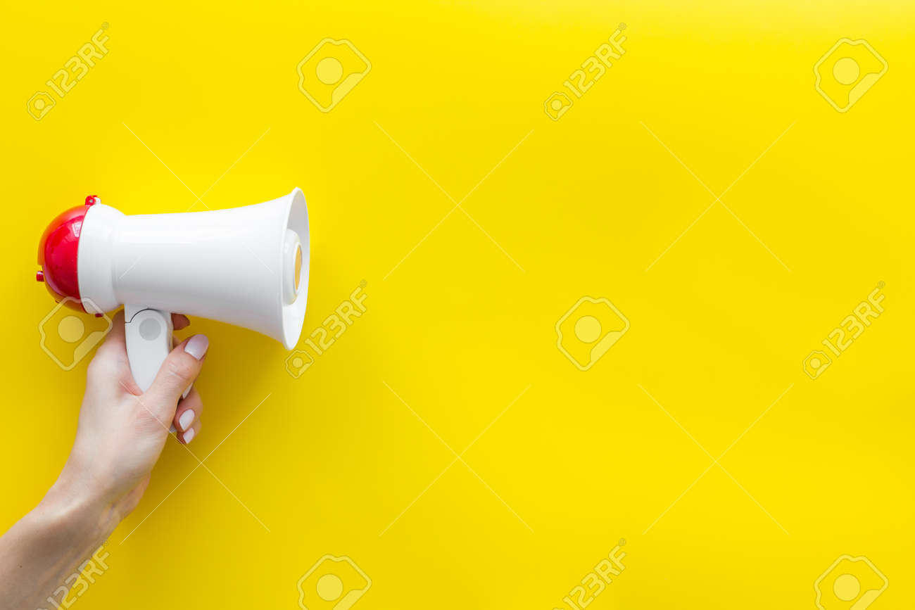 Download Symbol Of Announce Announcement With Megaphone In Hand On Yellow Stock Photo Picture And Royalty Free Image Image 128552222