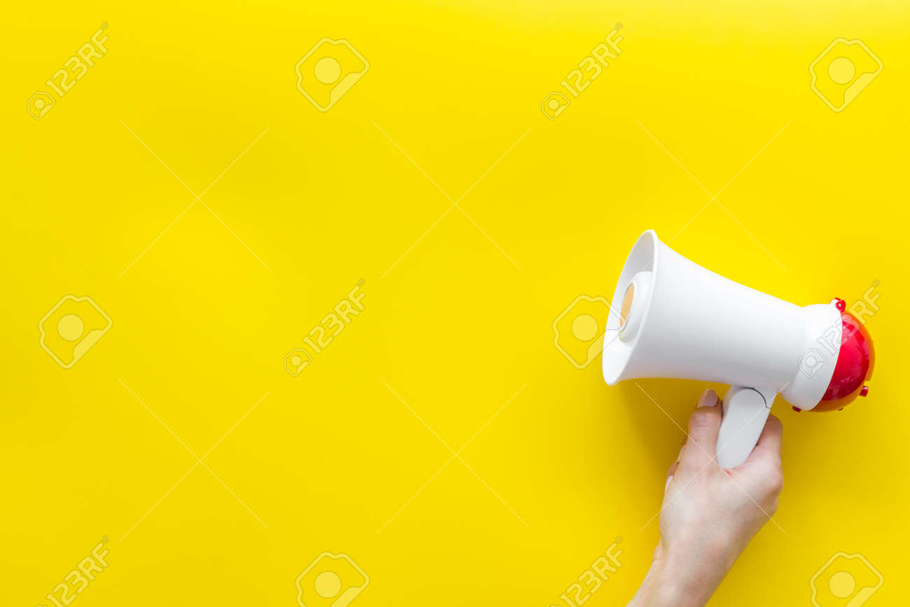 Download Announcement With Megaphone In Hand On Yellow Background Top Stock Photo Picture And Royalty Free Image Image 128867315