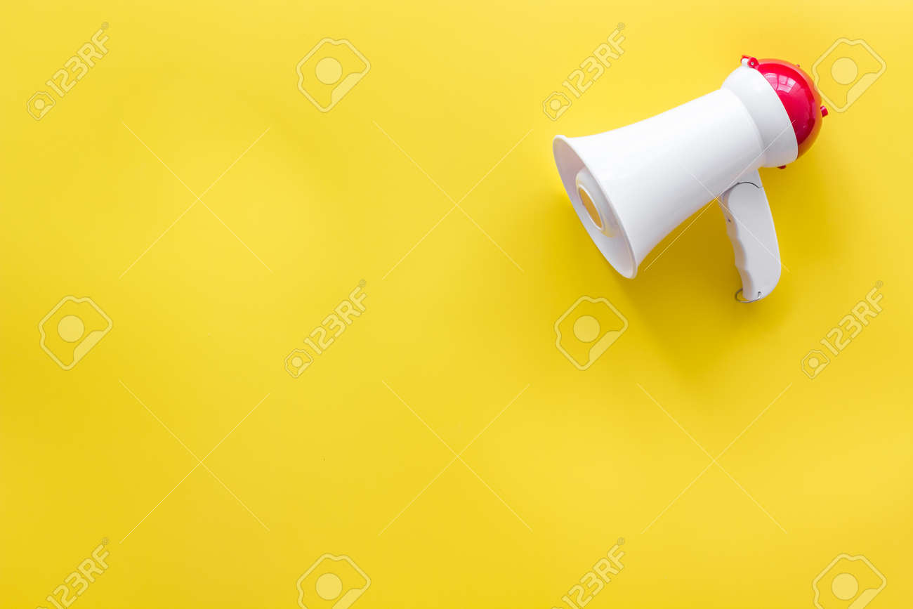 Download Announcement With Megaphone On Yellow Background Top View Mockup Stock Photo Picture And Royalty Free Image Image 128868342