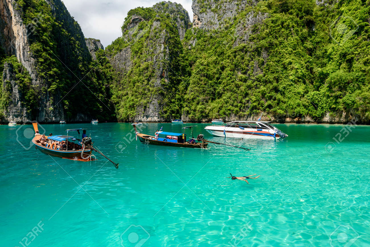 Tourist Enjoy Beautiful Crystal Clear Water At Pileh Bay At Phi