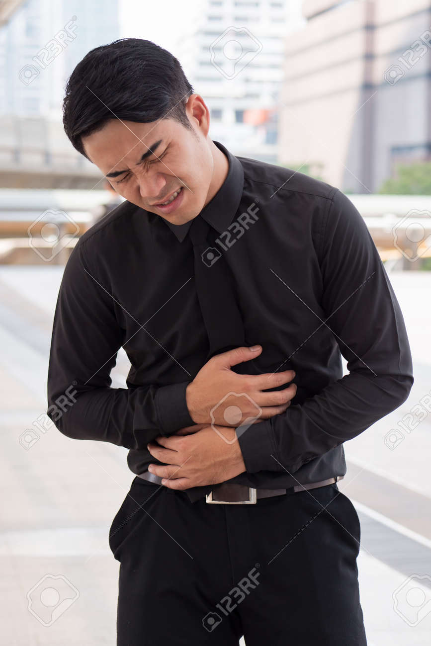 man suffering from stomach ache, diarrhea, constipation, acid reflux, indigestion, nausea - 81032493 man suffering from stomach ache, diarrhea, constipation, acid reflux, indigestion, nausea - 81032493