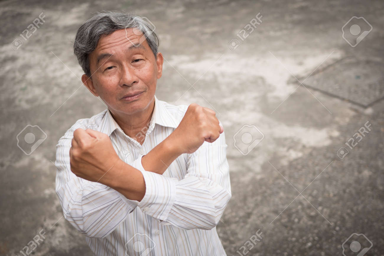 senior old man crossing arm saying no rejecting gesture stock photo