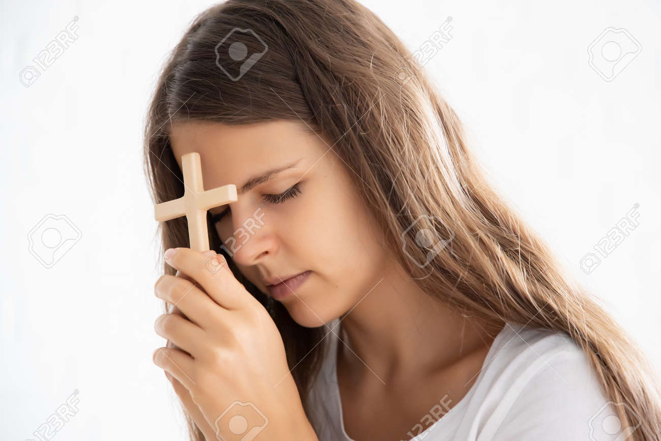 Religious Christian Woman Disciple Praying To God With Holy Cross Stock  Photo, Picture and Royalty Free Image. Image 151171935., image size:1300x867