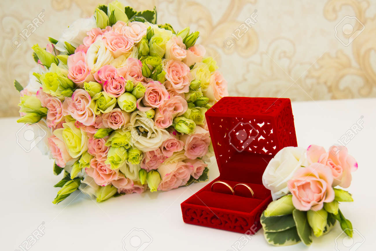 Gold Wedding Ring Red Box Grooms Boutonniere And A Bouquet