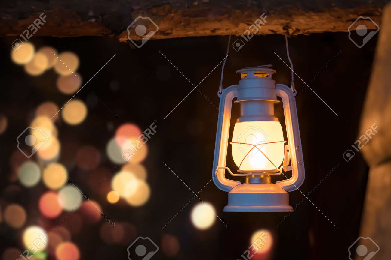 Old Lit Kerosene Lamp Hanging From A Wooden Beam In A Shed In A Village,  Northern Norway Stock Photo, Picture and Royalty Free Image. Image  127610122.