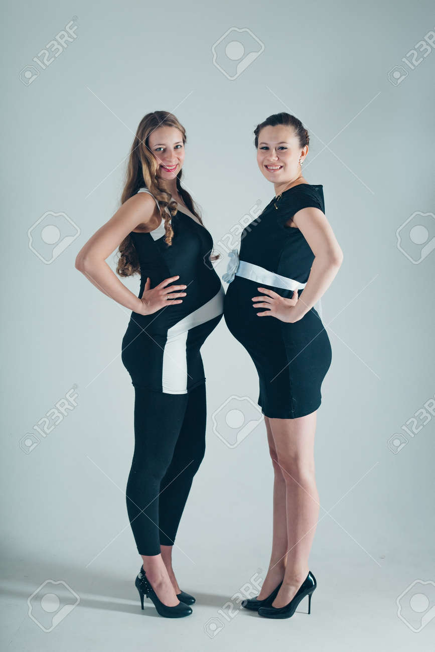 Two Pregnant Women In Black And White Dresses On White Background Stock Photo Picture And Royalty Free Image Image 105327886