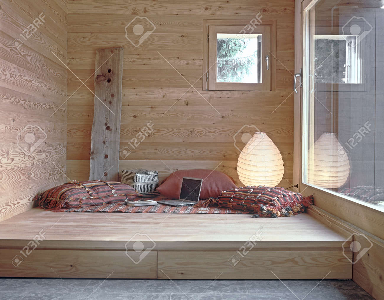 Interior View Of A Rustic Living Room With Wooden Paneling And
