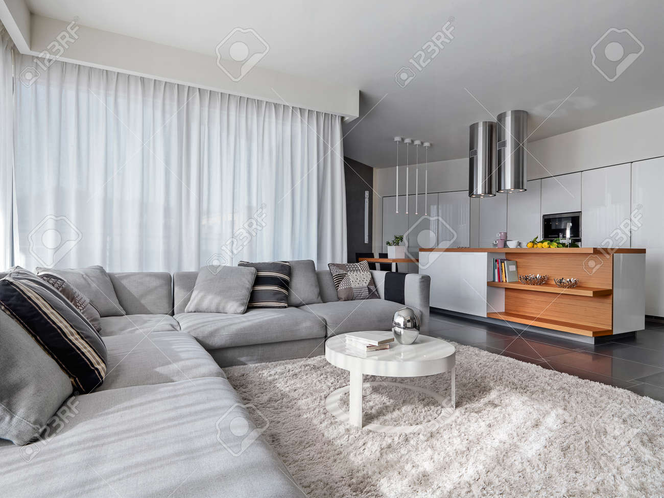 fabric sofa in the modern living room overlooking on the kitchen.. fabric sofa in the modern living room overlooking on the kitchen..