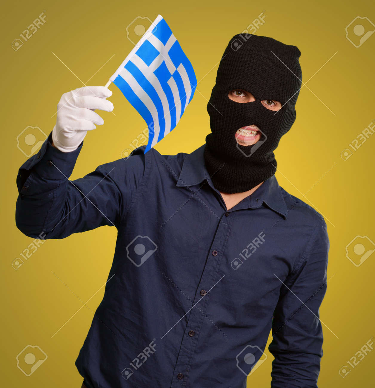 Download Man Wearing Robber Mask And Holding Flag On Yellow Background Stock Photo Picture And Royalty Free Image Image 16039247 PSD Mockup Templates