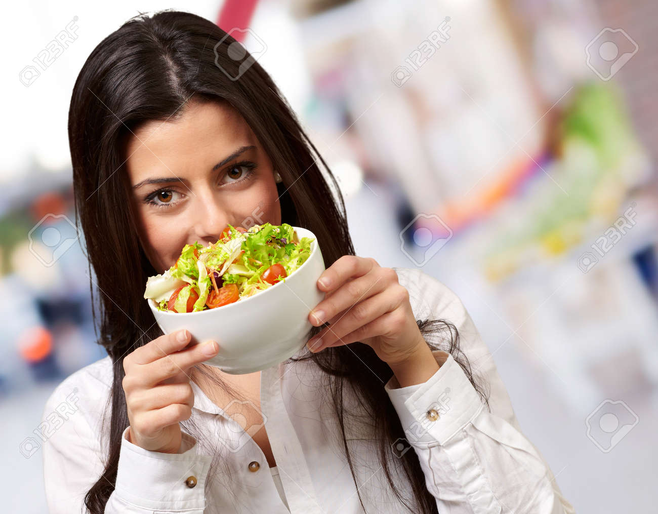 portrait of young woman holding a fresh salad at street - 16252295 portrait of young woman holding a fresh salad at street - 16252295