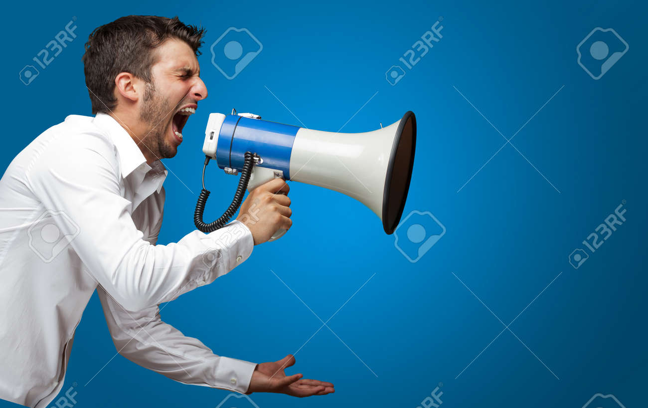 16690618-Portrait-Of-A-Man-Yelling-Into-A-Megaphone-Against-Blue-Background-Stock-Photo.jpg