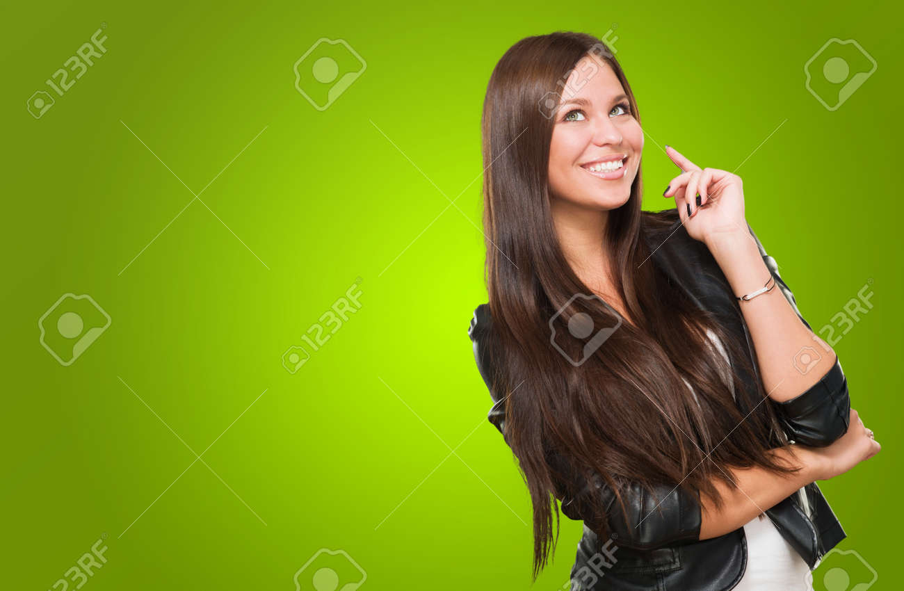 Portrait Of A Happy Woman against a green background - 16672455 Portrait Of A Happy Woman against a green background - 16672455