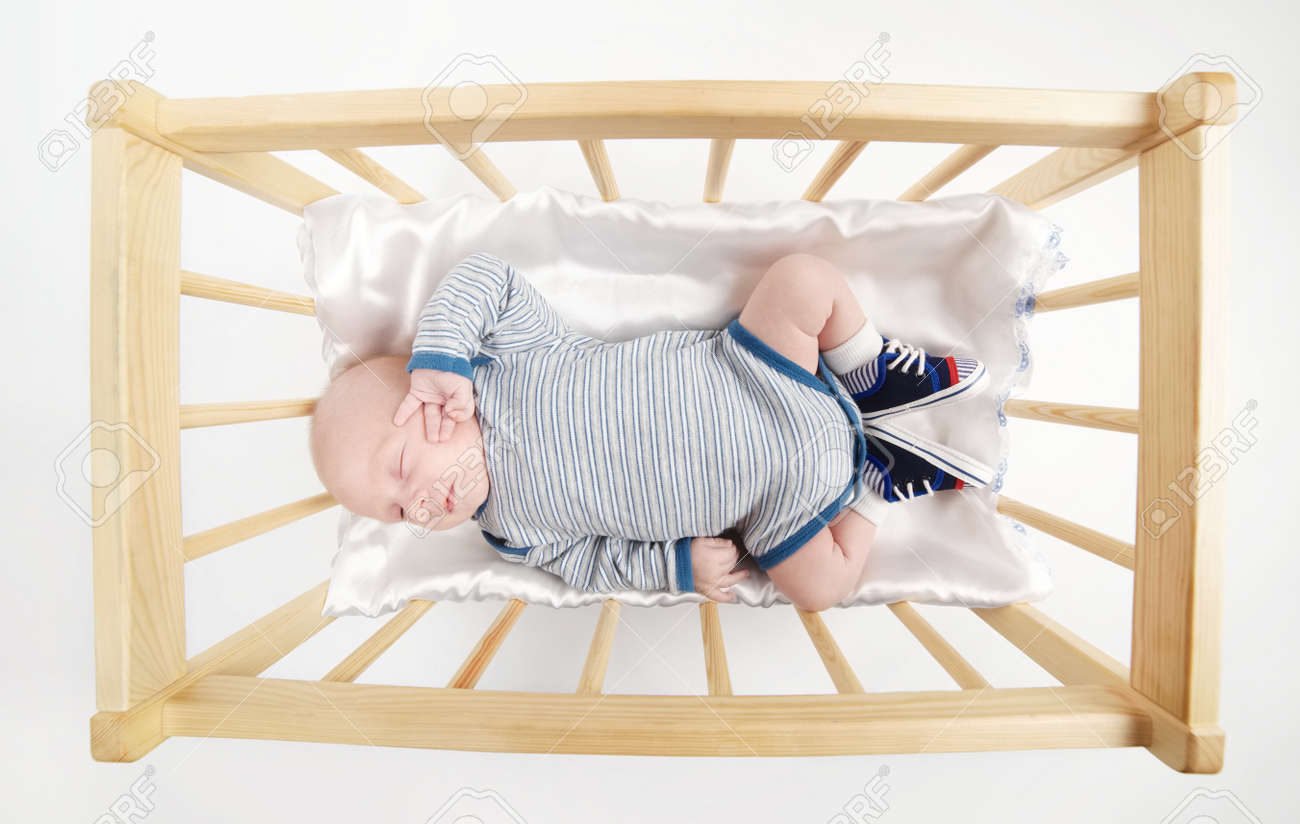 baby sleeping wooden bed