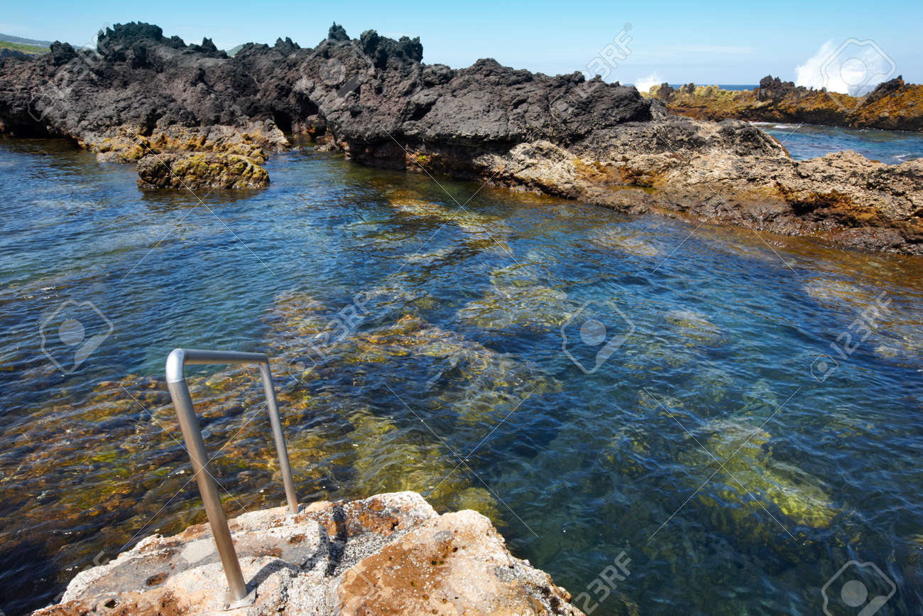 Rocky pool beach with stairs in biscoitos. terceira island. azores ...