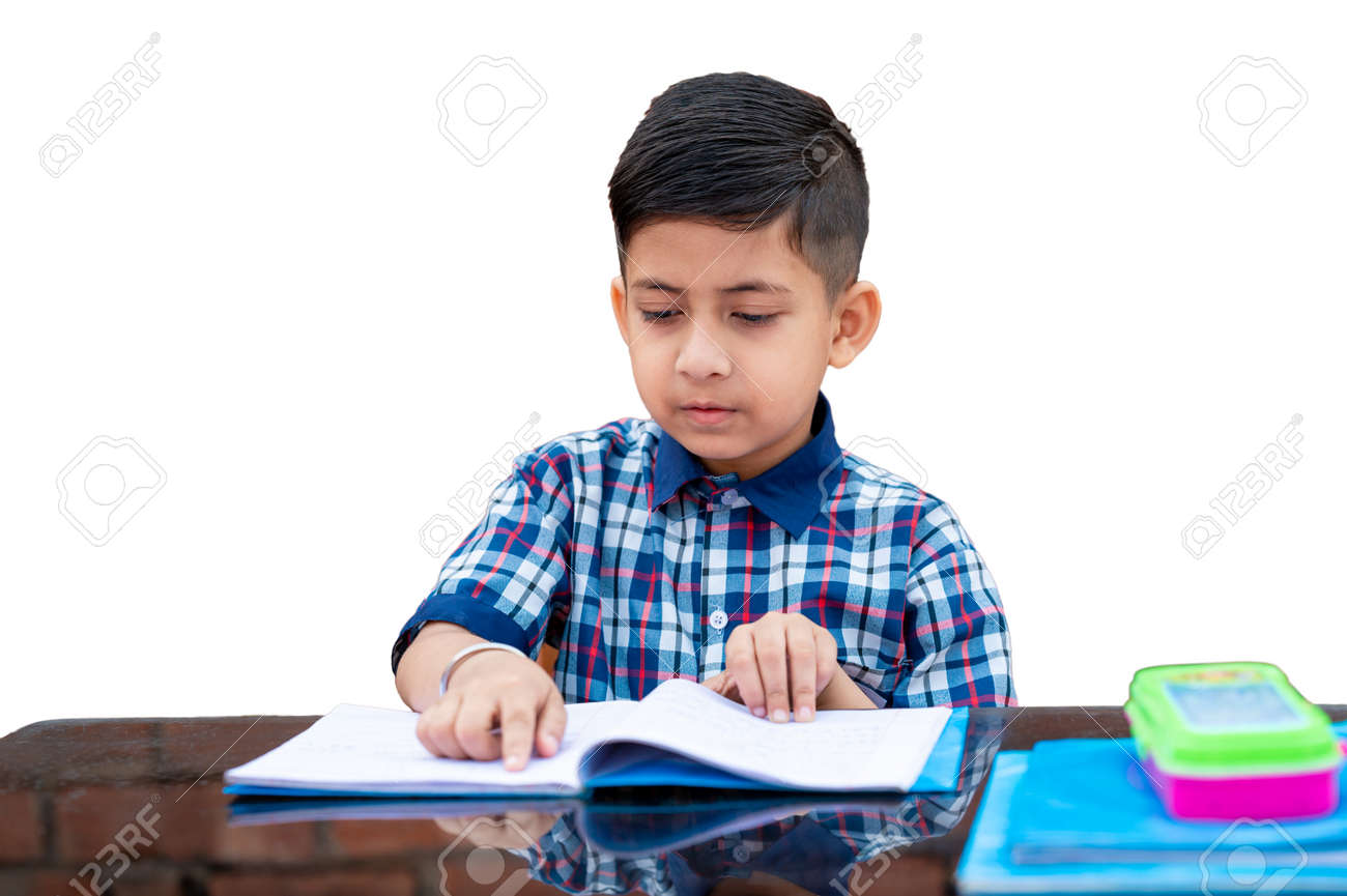 Primary School Student In Proper School Uniform Reading Book On Study Table  In Classroom. Indian Education System In Primary School. Stock Photo,  Picture and Royalty Free Image. Image 154238490., image size:1300x865