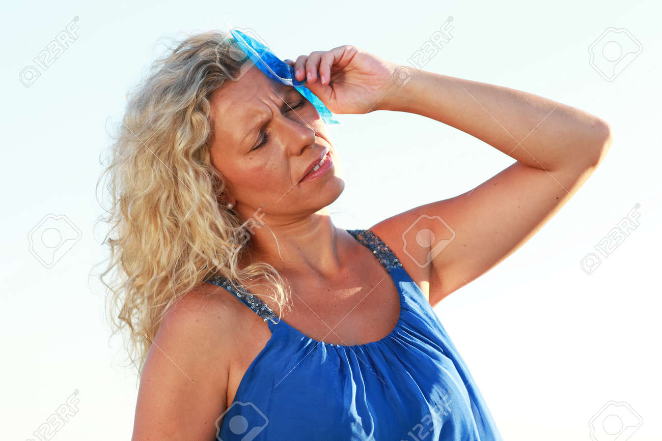 Mature Woman With Ice Pack In Summer Heat Outdoor Stock Photo, Picture And  Royalty Free Image. Image 80637787.