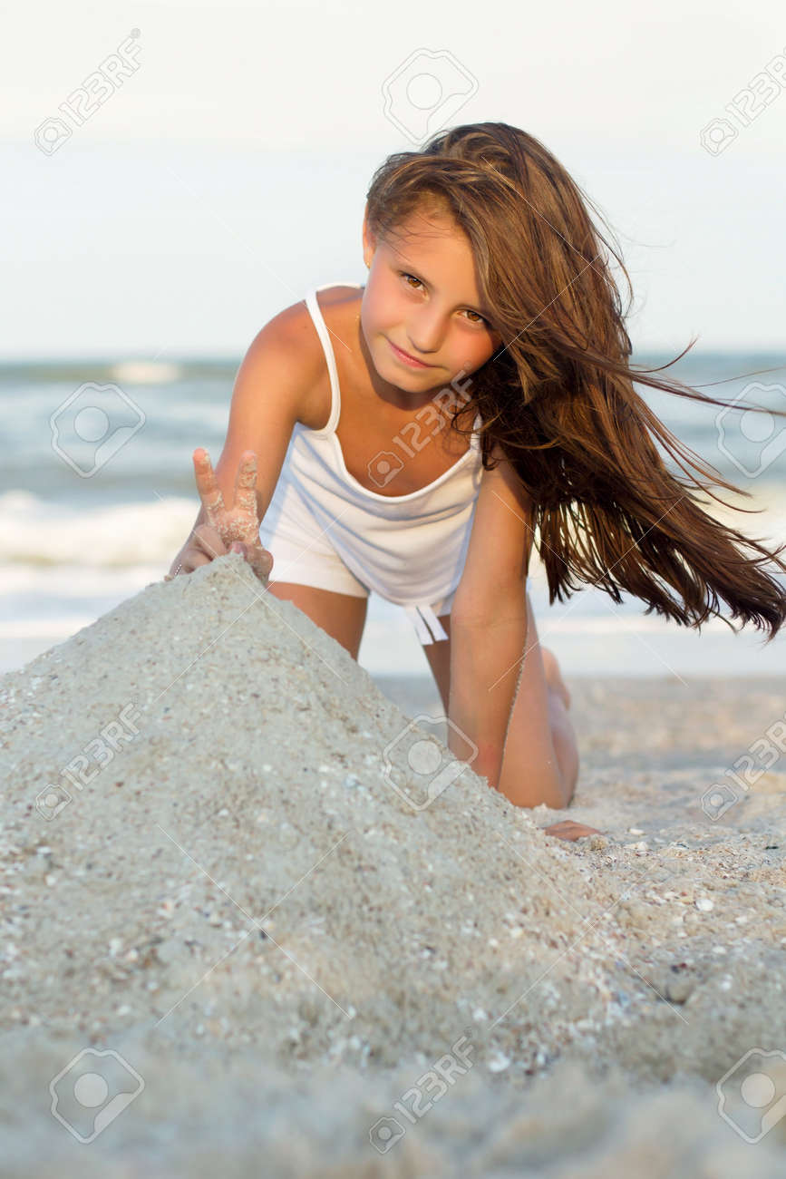 Pretty Little Girl Playing On The Beach Stock Photo Picture And Royalty Free Image Image