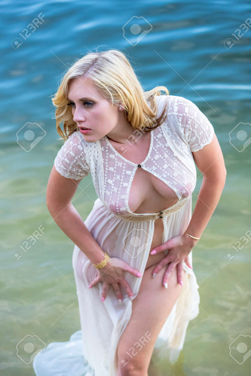 A gorgeous blonde model enjoys the lake on a summers day - 130423474 A gorgeous blonde model enjoys the lake on a summers day - 130423474